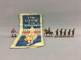 Group of vintage metal soldiers and 1910 book