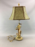 Antique metal man figure lamp
