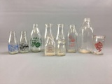 Group of 10 vintage milk bottles