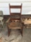 antique rocking chair with weaved seat