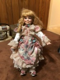 Porcelain doll with stand