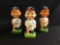 Group of three vintage New York Yankees and Boston Red Sox porcelain bobble heads