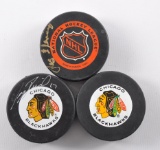 Group of 2 Signed Blackhawks and One Unsigned NHL Hockey Pucks