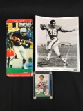 Group of O.J. Simpson memorabilia featuring photograph, card, and action figure card