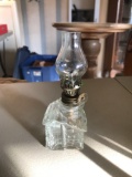 Miniature log cabin oil lamp