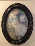 Framed oval print of boy and girl