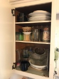 Cabinet full of misc dishes plates and bowls