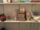 Shelf lot of clear glass pitchers, vases and more
