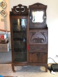Antique quartersawn oak secretary with curved glass door and beveled glass mirror