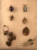 Group of sterling silver pendants & brooch