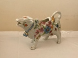 Porcelain cow creamer with floral design