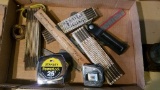 box lot of rulers and tape measures