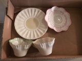 Group of Belleek saucers and cups