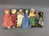 Group of 7 vintage hand carved wooden dolls