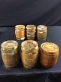 Group of six barrel advertising coin banks