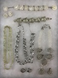 Vintage jewelry lot in silver and clear tones