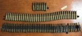 Group of three chain links of 7.62 military blank ammunition