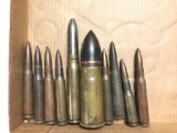 Group of empty large military rounds