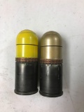 Group of two empty practice M 169 grenade rounds