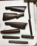 Group of antique rifle stocks and parts