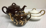 Group of Brown Gold and Cream Teapots