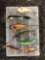 Group of seven fishing lures and two spoons