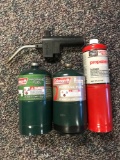 Group of three propane tanks and one torch head