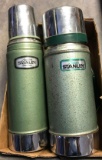 Two Stanley thermos