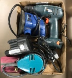 Group of corded sanders and a cordless drill