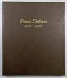 Lot of (23) Peace Dollars in Dansco Album.