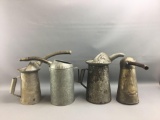 Group of 4 oil cans with spouts