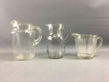 Group of 3 clear glass pitchers