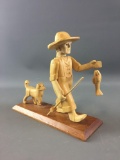 Hand carved Fishing man with dog