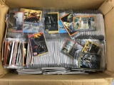 Large group of Jurassic Park trading cards sealed in packs