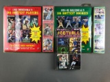 Baseball and football trading cards sealed in original packaging