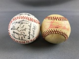 2 signed baseballs