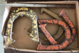 Group of five horseshoes and a pole