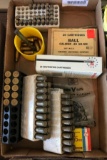 Group of brass casings and live ammunition