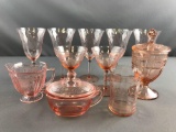 Group of 11 pink depression glass pieces