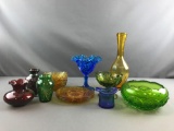 Group of colored glass plates, bowls, vases and more