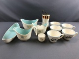 Group of porcelain cups, mill, sugar, creamer and more