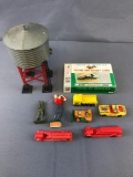 Group of toy cars, history cards, and more