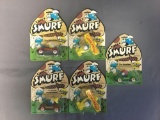 Group of 5 die cast Ertl Smurf Vehicles in original packaging