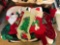 Group of Christmas stockings and quilted Santa
