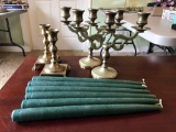 Group of brass candleholders and candles