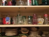 Shelf of miscellaneous Pepsi, Coca-Cola glasses and more