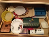 Shelf of miscellaneous Tupperware and more