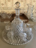 Group of clear pressed glass decanter glasses and tray