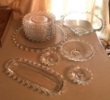Group of 19 Vintage Clear Glass swirl rimmed dishes