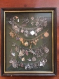 Shadowbox with antique charm bracelets